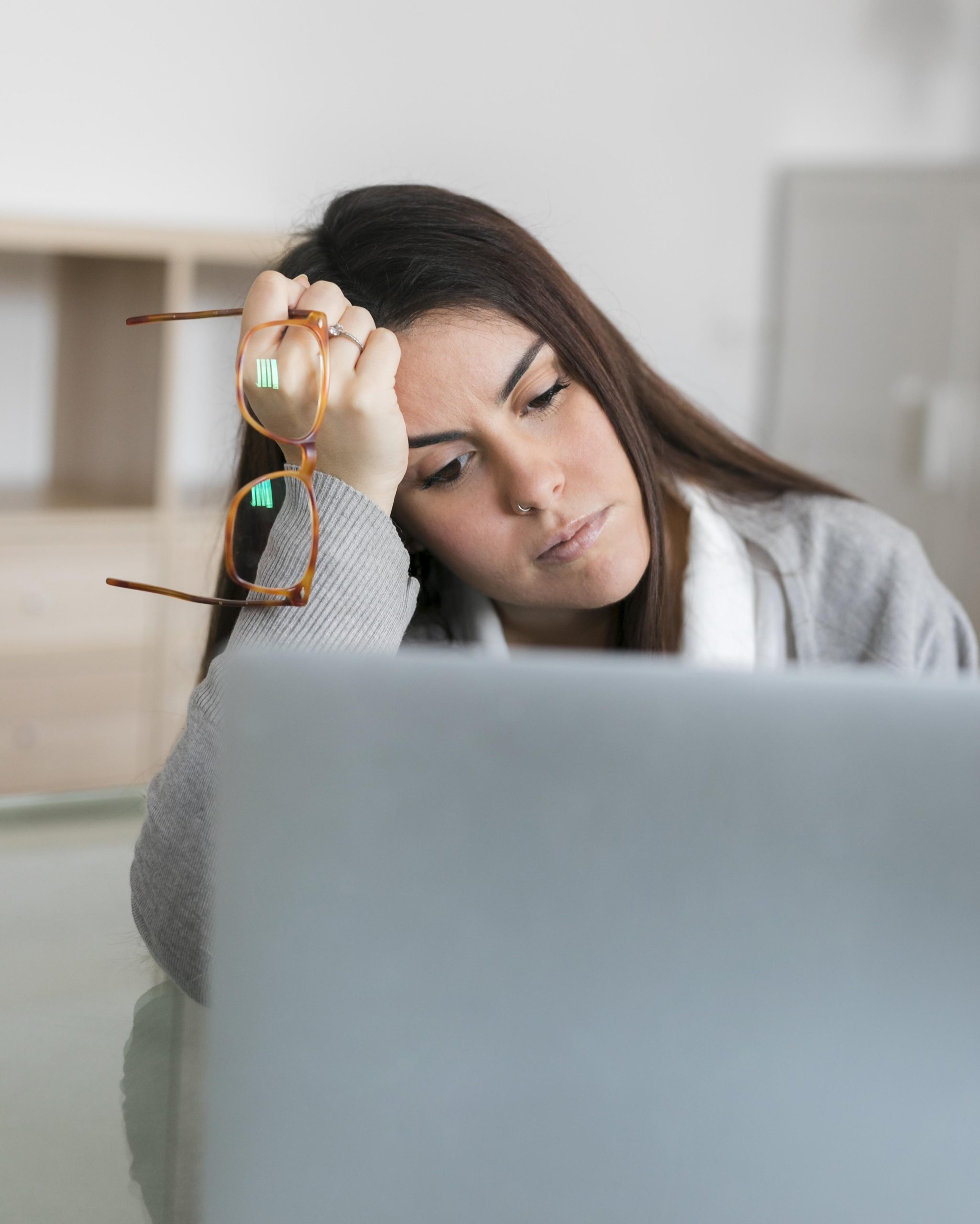 https://psychquility.com/wp-content/uploads/2023/04/woman-working-laptop-holding-glasses-scaled.jpg